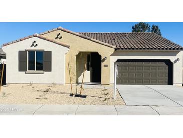 New stucco home with tile roof, 2-car garage, and desert landscaping at 17469 N 66Th Ave, Glendale, AZ 85308