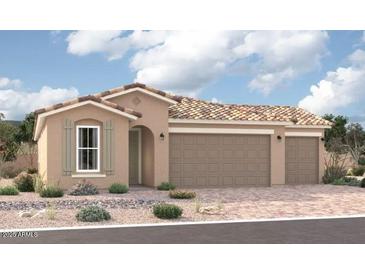 Single-story home with three-car garage and desert landscaping at 18228 W Hess St, Goodyear, AZ 85338