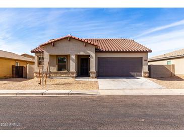 One-story house with brown roof and gray exterior, two-car garage, and desert landscaping at 2355 N Oakmont Ln, Casa Grande, AZ 85122