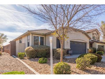 House exterior with gray garage door and desert landscaping at 2981 E Nighthawk Way, Phoenix, AZ 85048