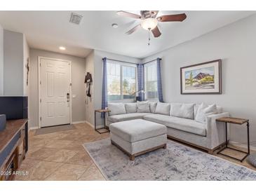 L-shaped sofa, ottoman, and built-in shelving at 2981 E Nighthawk Way, Phoenix, AZ 85048