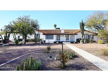 Charming single story home with desert landscaping and a large driveway at 3502 N 22 St, Phoenix, AZ 85016