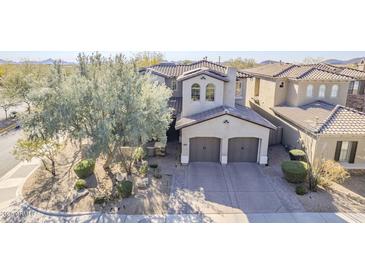 Two-story home with two-car garage and landscaped front yard at 3729 E Donald Dr, Phoenix, AZ 85050