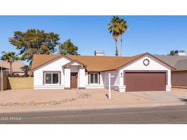 Charming single story home with a brown door and attached garage at 3930 W Saragosa W St, Chandler, AZ 85226