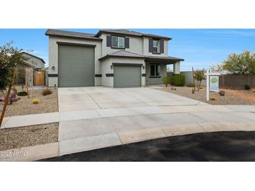 Charming two-story home with a three-car garage and low-maintenance desert landscaping at 17706 W Villa Chula Ln, Surprise, AZ 85387