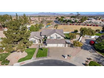 Two-story home with a large backyard, three-car garage, and mountain views at 1848 E Mallory St, Mesa, AZ 85203