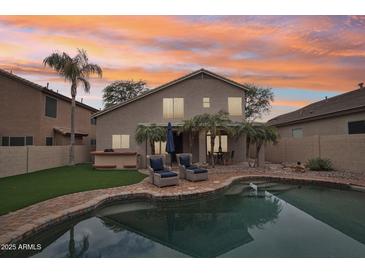 Home features a backyard with a pool and patio furniture, perfect for entertaining at 26645 N 42Nd St, Cave Creek, AZ 85331