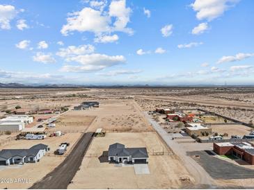 Expansive desert property featuring horse facilities and ample space for outdoor living at 28813 N 201St Ave, Wittmann, AZ 85361