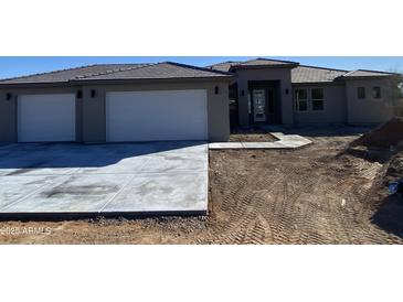 Charming home featuring a two-car garage and a well-manicured lawn, offering great curb appeal at 31505 N 166Th Pl, Scottsdale, AZ 85252