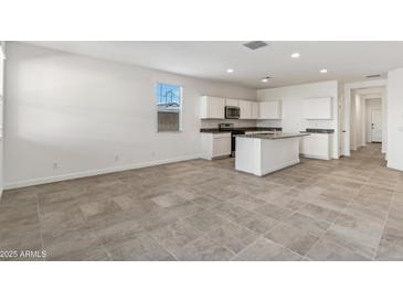 Modern kitchen with island, stainless steel appliances, and granite countertops at 40055 W Venture Rd, Maricopa, AZ 85138