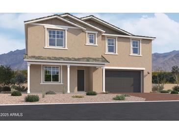 Two-story house with a large garage and desert landscaping at 7662 W Rowel Rd, Peoria, AZ 85383