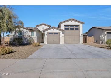 Two-story house with a two-car garage and landscaped front yard at 8026 W Wood Ln, Phoenix, AZ 85043