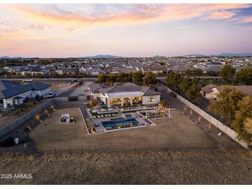 Luxury home with pool and expansive backyard, offering stunning sunset views at 14821 E Chandler Heights Rd, Chandler, AZ 85249