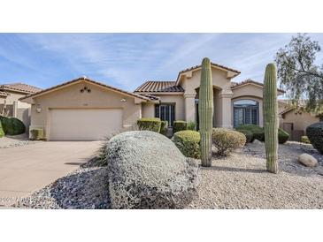 Tan house with a two-car garage and desert landscaping at 17421 E Via Del Oro --, Fountain Hills, AZ 85268