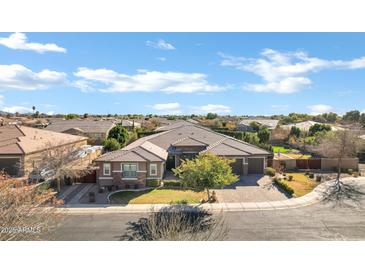 Beautiful single-Gathering home featuring a well-manicured front yard and a three-car garage at 1783 E Desert Broom Pl, Chandler, AZ 85286