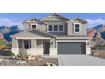 Two-story house with gray siding, a three-car garage, and desert landscaping at 2320 W Moody Trl, Phoenix, AZ 85041