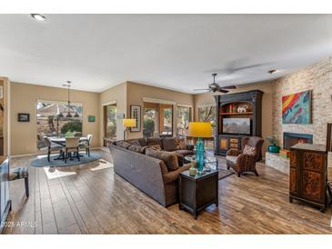 Spacious living room with fireplace and hardwood floors at 27608 N Montana Dr, Rio Verde, AZ 85263