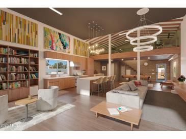 Spacious living room with modern kitchen, artistic decor, and open floor plan perfect for entertaining guests at 3312 E Flower St, Phoenix, AZ 85018