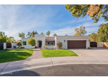 Stunning single-story home with a beautifully landscaped front yard and attached garage at 9254 N 82Nd St, Scottsdale, AZ 85258