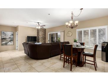 Spacious living room with comfortable seating and a fireplace at 11260 N 92Nd St # 1102, Scottsdale, AZ 85260