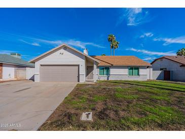 Charming single story home with a well-manicured lawn and attached garage at 110 W San Pedro Ave, Gilbert, AZ 85233