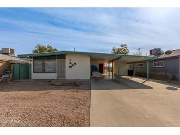 Ranch style home with carport and spacious driveway at 633 W 1St St, Mesa, AZ 85201