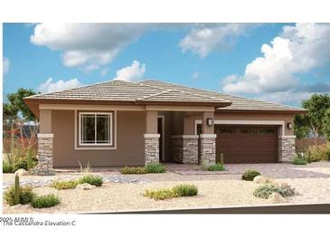 Single-story home with brown roof, stone accents, and two-car garage at 21888 E Saddle E Ct, Queen Creek, AZ 85142