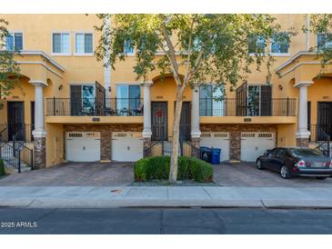 Three-unit townhome building with attached garages and private balconies at 421 W 6Th St # 1009, Tempe, AZ 85281