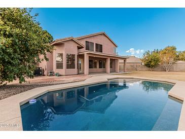 Home with a sparkling pool and spacious backyard at 1503 N Quail Ln, Gilbert, AZ 85233