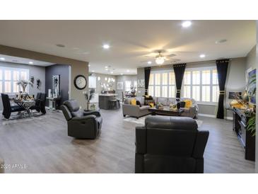 Spacious living room with hardwood floors and comfortable seating at 20509 N Enchantment Pass, Maricopa, AZ 85138