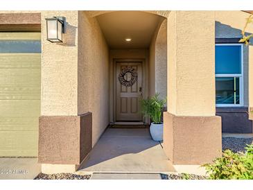 Inviting entryway with a decorative wreath and welcoming ambiance at 24550 W Pima St, Buckeye, AZ 85326