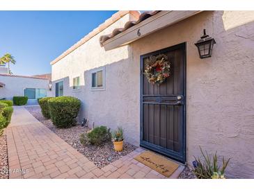 Inviting exterior of condo with a walkway leading to the entrance at 12012 N Saguaro Blvd # 6, Fountain Hills, AZ 85268