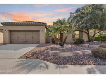 Beautiful desert landscaping highlights this single-story home with a two-car garage at 12629 W Bajada Rd, Peoria, AZ 85383