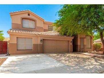 Two-story house with a large garage and mature landscaping at 16205 S 7Th St, Phoenix, AZ 85048