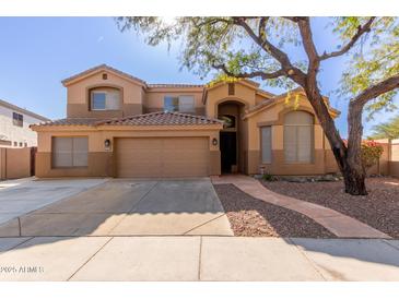 Two-story house with a large three-car garage and landscaped front yard at 16205 S 7Th St, Phoenix, AZ 85048