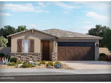 One-story home with brown garage door and stone accents at 24353 W La Salle St, Buckeye, AZ 85326