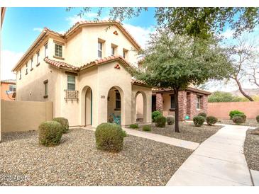 Two-story house with Spanish-style architecture, landscaping, and walkway at 26015 N 53Rd Dr, Phoenix, AZ 85083