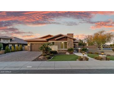 Stunning curb appeal featuring a beautifully landscaped yard and inviting entryway at 3560 E Ironside Ln, Gilbert, AZ 85298