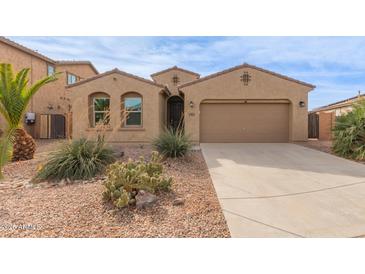 One-story house with desert landscaping, two-car garage, and neutral color palette at 40861 W Little Dr, Maricopa, AZ 85138