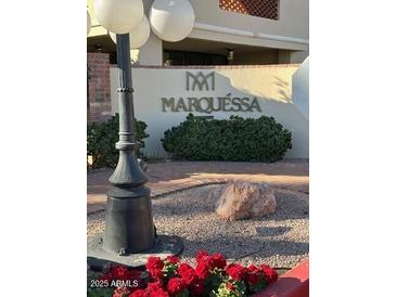 Marquessa community entrance with landscaping and signage at 4200 N Miller Rd # 112, Scottsdale, AZ 85251