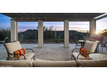 Relaxing patio with seating area and sunset views at 4332 S Primrose Dr, Gold Canyon, AZ 85118