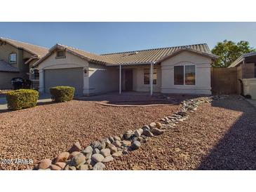 One-story house with a two-car garage and landscaped front yard at 8623 W Athens St, Peoria, AZ 85382