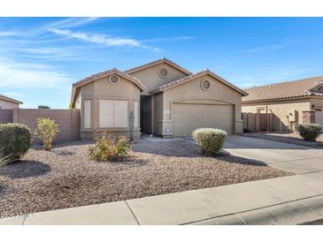 One-story house with a two-car garage and landscaped front yard at 1361 E Martha Dr, Casa Grande, AZ 85122