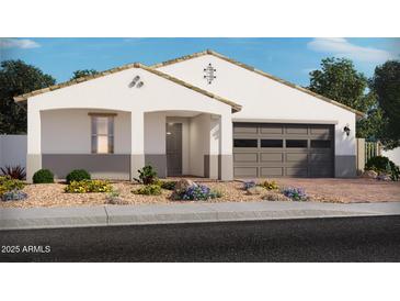 Single-story home with gray garage door and landscaping at 17697 W Southgate Ave, Goodyear, AZ 85338