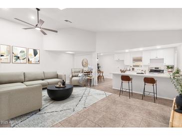 Open living room, kitchen, and dining area with modern design at 25636 S Howard Dr, Sun Lakes, AZ 85248
