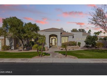 Elegant single-story home with a welcoming entryway and landscaped front yard at 4330 E Gemini Pl, Chandler, AZ 85249