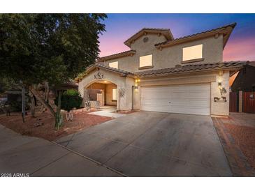 Two-story house with a large driveway and landscaped front yard at 45354 W Horse Mesa Rd, Maricopa, AZ 85139