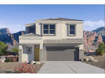 Two-story house with a gray garage door and desert landscaping at 5132 E Umber Rd, San Tan Valley, AZ 85143