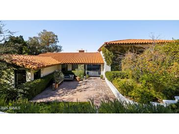 Inviting home exterior with terracotta roof and landscaped courtyard at 5328 N 46Th St, Phoenix, AZ 85018