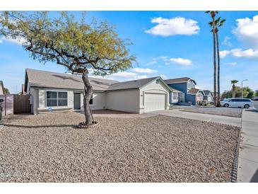 Single story home with a large front yard and gravel landscaping at 5415 N 79Th Dr, Glendale, AZ 85303